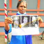 Kanchipuram: A woman wearing a thali for the portraits of Periyar, Maniyamai and Veeramani and protesting in the streets