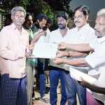 A program was held in Meenjur Arunodaya Nagar where the tribal people gave 17 fishermen welfare identity cards-p2